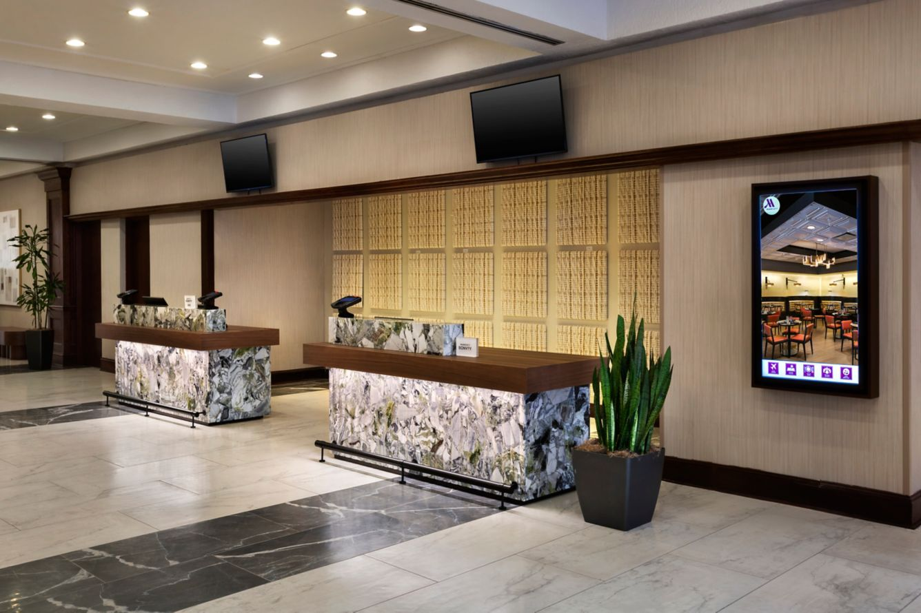 Luxury hotel lobby with marble fireplace and chandelier